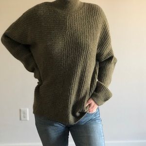 Green turtleneck sweater